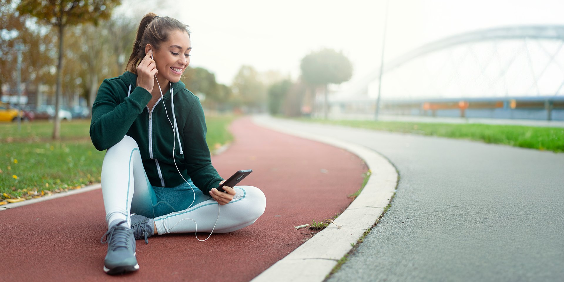 Runner resting on track